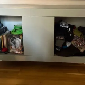 Grey storage unit, open and closed shelves, chrome legs
