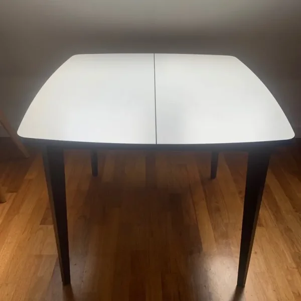 Extending table (with two white chairs)