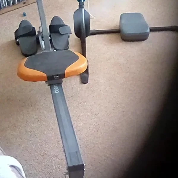 Rowing machine and abs trimmer