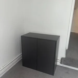 Cupboard with shelves and push-to-open doors