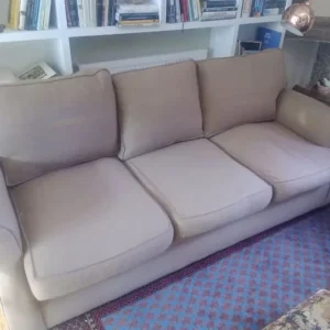 Brown three seated sofa