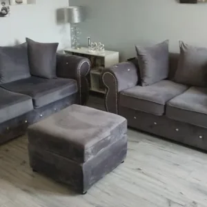 Slate gray chesterfield style sofa set with footstool
