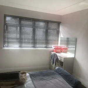 Large bedroom with fitted wardrobes and dressing table - Image 2