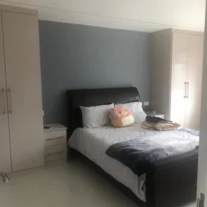 Large bedroom with fitted wardrobes and dressing table