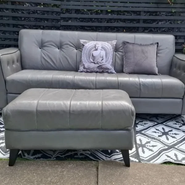 Grey 3 seater leather sofa with footstool