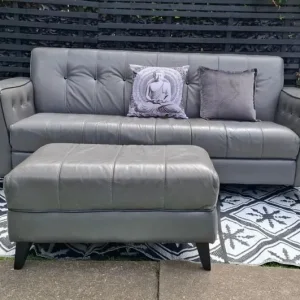 Grey 3 seater leather sofa with footstool