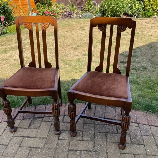 Two traditional wooden dining chairs