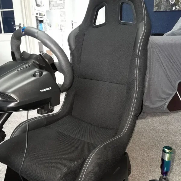 Playseat gaming chair with Logitech G wheel, pedals and shifter
