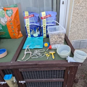 Solid single-storey rabbit hutch with hay, muesli, and extras