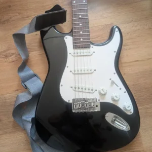 Electric guitar with amp and aux cable - Image 3