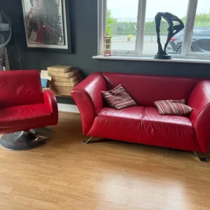 White leather sofa and swivel chair