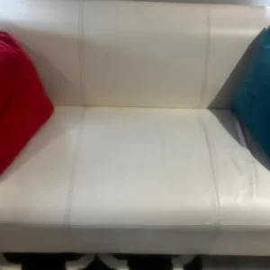 White two-seater leather sofa