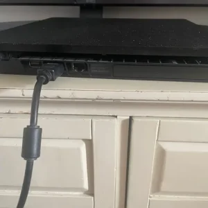 PS4 console with two controllers and three games - Image 3