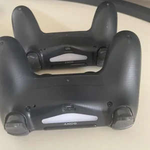 PS4 console with two controllers and three games - Image 6