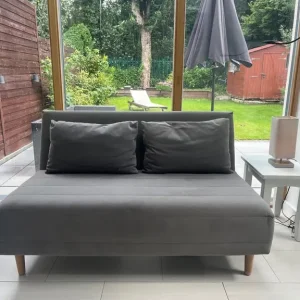Small compact grey sofa bed