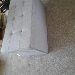 Grey storage box with padded lid