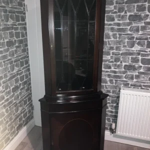 Living room unit with glass shelves and lockable doors