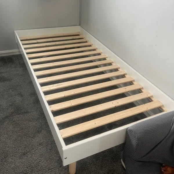 White wooden single bed