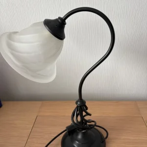 Black wrought iron and frosted glass table lamp