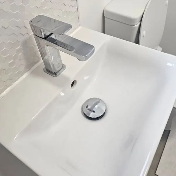 Sink, tap and pedestal less than a year old