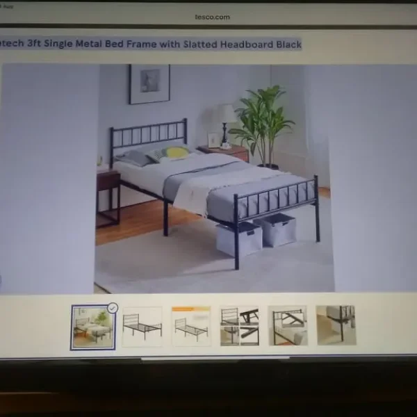 Single bed with metal headboard