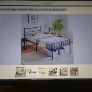 Single bed with metal headboard