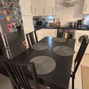 IKEA black extendable dining table with 4 chairs - Image 2