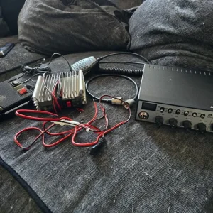 CB radio setup with amp and antenna
