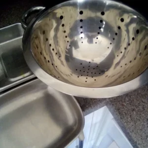 Stainless steel oven dishes and colander