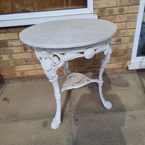 Marble top white cast iron garden table
