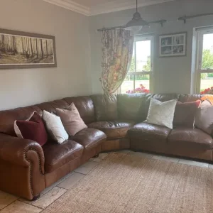 Genuine leather corner sofa and footstool