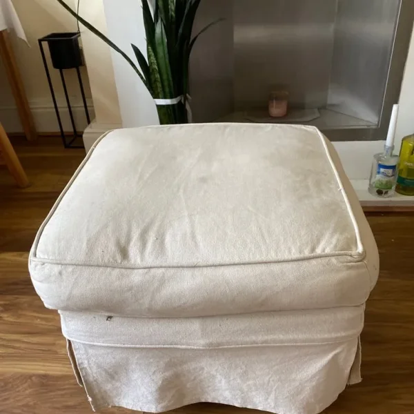 Cream footstool with removable covers