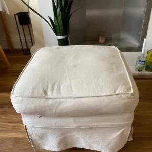 Cream footstool with removable covers