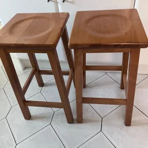 Two heavy wooden stools