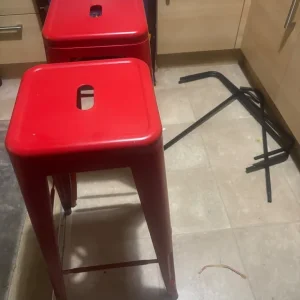 Two red bar stools