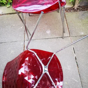 Three red plastic chairs - Image 2
