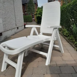 Plastic chair with detachable leg rest