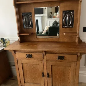 Arts and crafts oak dresser with decorative panels