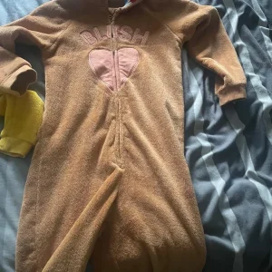 Pudsey blush onesie size 8-9