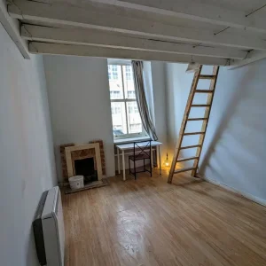Artist's studio room with mezzanine and work sink