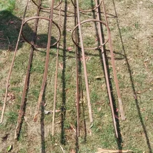 Pair of vintage 8ft garden obelisks with solid steel and cast iron crowns