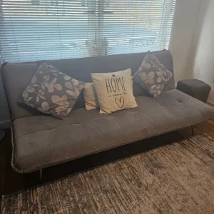 Grey sofa bed with click clack mechanism