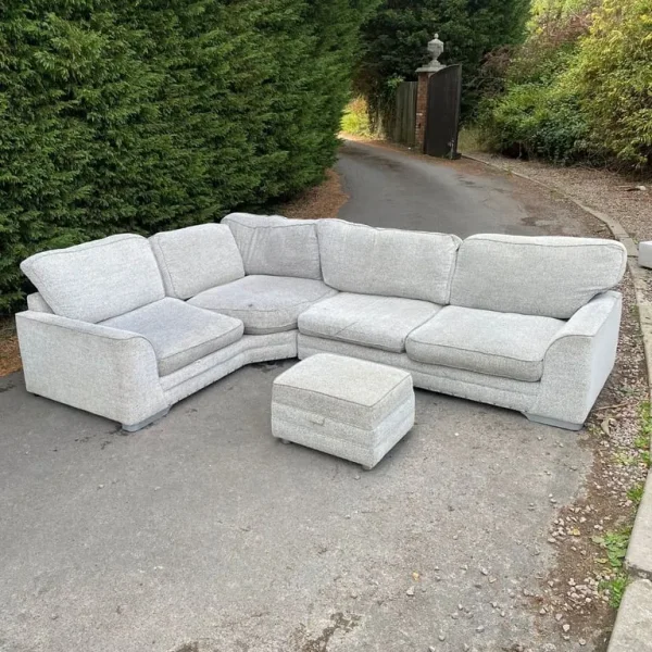Corner sofa with footrest in cream