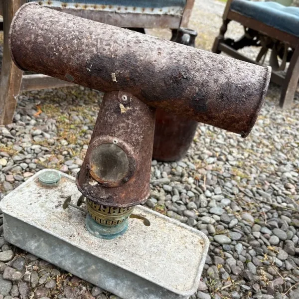 Antique blowtorch, tins, ironing board and other odds and ends