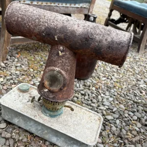 Antique blowtorch, tins, ironing board and other odds and ends