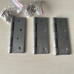 Three B & Q 100mm stainless dry butt hinges with screws