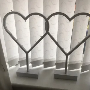 3 wooden heart ornaments with lights