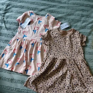 2 BNWT GIRLS DRESSES 18 TO 24 MONTHS