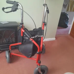 3 wheeled walker with shopping bag and brakes