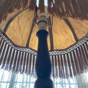 Dark wood floor lamp with tassel shade